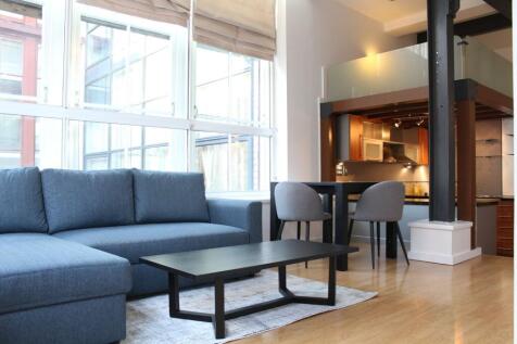 A two bedroom apartment within the beautifully converted Asia House development. Positioned on the fifth floor, consisting of spacious split level kitchen, living and dining area and a bed deck above