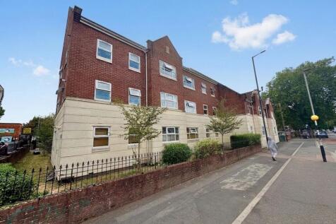 Modern 2 bed ground floor apartment with private terrace, off-street parking, open plan living, and central location near shops and transport. Ideal for professionals. Council Tax Band A.