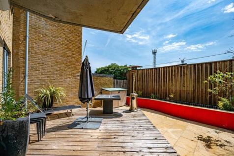 A beautifully presented three bedroom ground floor apartment set within a sought-after modern development in the heart of Primrose Hill. The property offers a spacious open plan living, dining and kit