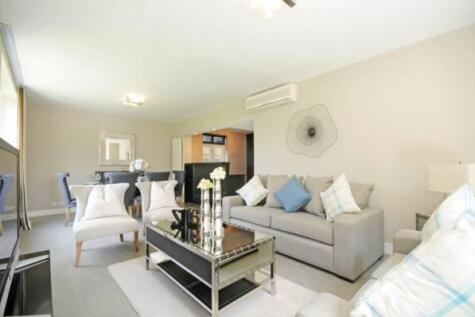 Beautifully refurbished three bedroom apartment with a large decked private garden and a separate fitness studio, on the ground floor of this popular purpose built block with excellent security.
