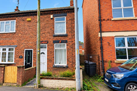 Sunny Red-Brick Terraced Street with Telegraph ...