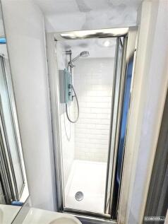 Modern shower cubicle with sleek tiling....