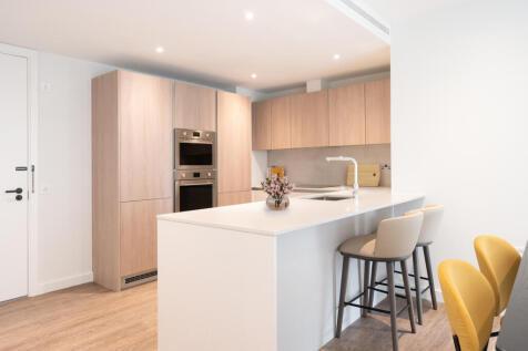 Experience luxury in this sleek modern kitchen, perfect for culinary creativity and social gatherings.