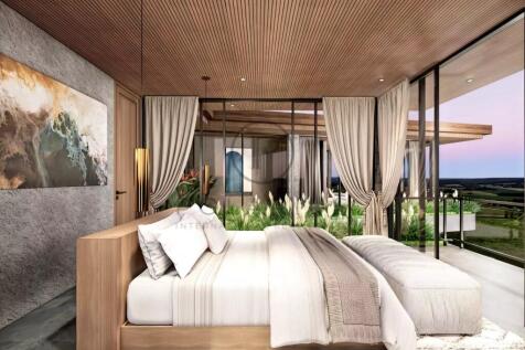 Modern bedroom with large windows, a wooden ceilin