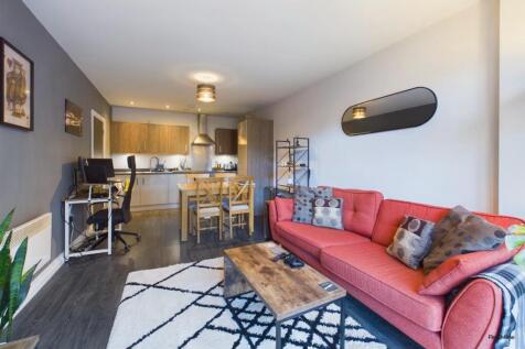 Welcome to this exquisite two-bedroom flat located in the vibrant Metalworks development on Warstone Lane, Birmingham. This modern apartment spans an impressive 664 square feet, offering a perfect ble