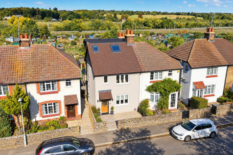 Sunny Edwardian Street with Countryside Views.png
