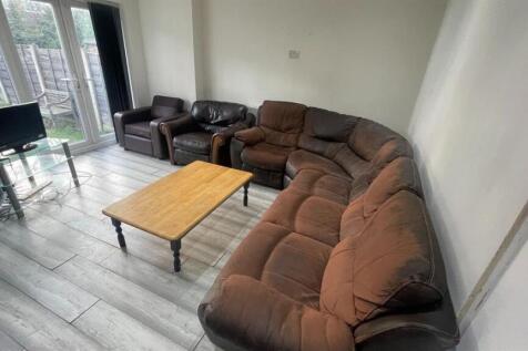 Spacious, well-lit living room with a large cor...