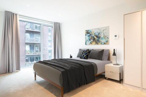 Experience the tranquility of this serene and stylish bedroom, perfect for restful nights.
