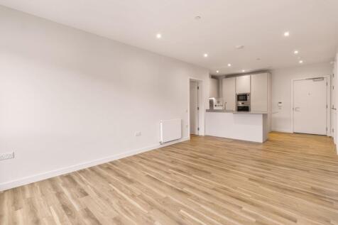 Experience the elegance of this spacious open-plan apartment featuring a modern kitchen.