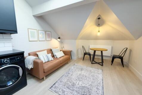 Bright, stylish living room with a comfortable ...