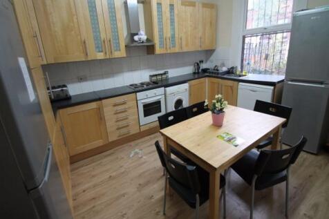 Bright and well-organized kitchen with natural ...