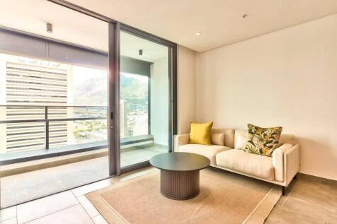 Open plan living opens onto private balcony