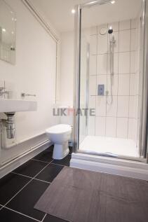 A modern and clean bathroom featuring a shower ...