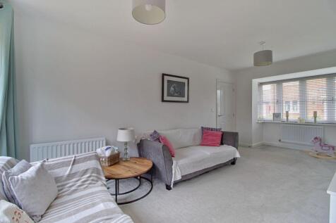 Living room with bay window and French doors