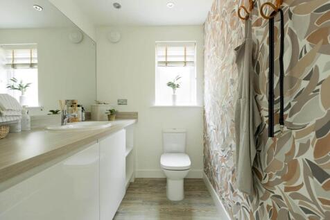 The guest cloakroom offers space for laundry appliances