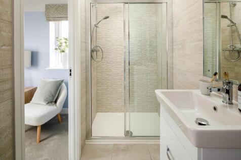 Bedroom 1 also hosts a private en suite shower room