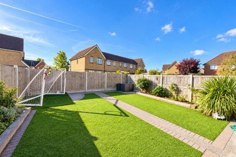 Sunny Suburban Garden with Football Goal.png