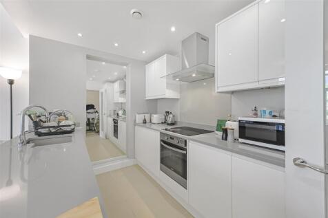 A stylishly refurbished two-bedroom apartment located on the fourth floor of this well-maintained purpose-built block, offering the convenience of a passenger lift, 24-hour concierge service, and acce