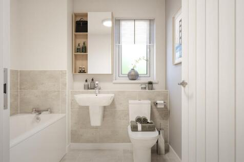 The main bathroom features high quality fixtures and fittings