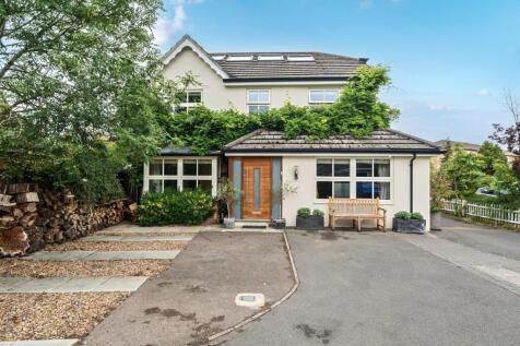 Situated in a quiet residential cul-de-sac on Biggin Hill Close, Kingston upon Thames, this beautifully extended and immaculately presented FIVE BEDROOM detached family home offers over 2,200 sq ft of