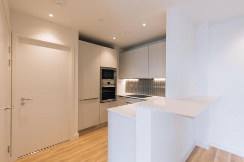 Experience the elegance of this sleek and modern kitchen, designed for efficiency.