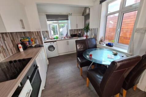 A bright and welcoming living room featuring am...