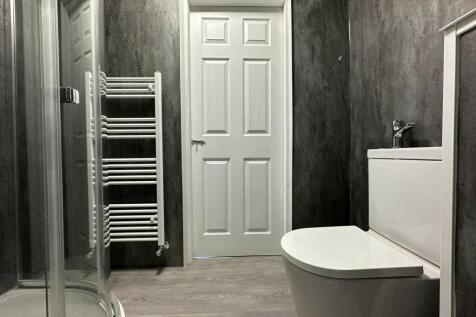 A modern, well-maintained bathroom with a clean...