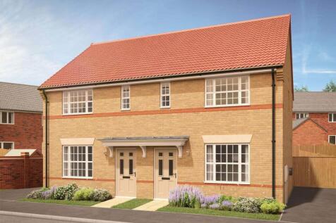 A modern beige brick semi-detached house with a red tiled roof stands in the foreground