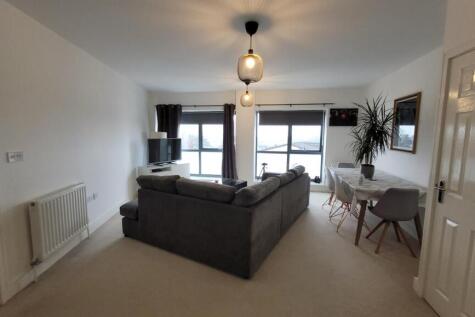 Well presented top floor flat close to local amenities. With accommodation comprising open plan living/kitchen area, 2 bedrooms and family bathroom. Further benefits include gas central heating and 1