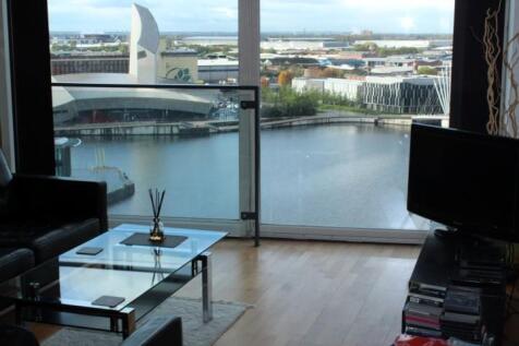 Welcome to this stunning two-bedroom, two-bathroom apartment located in the desirable City Lofts at 94 The Quays, Salford Quays. This modern flat offers a perfect blend of comfort and style, making it