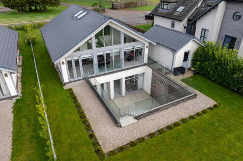Smart Homes are delighted to showcase this contemporary architect designed two storey detached family home situated within an exclusive development with open countryside views. Offering spacious accom