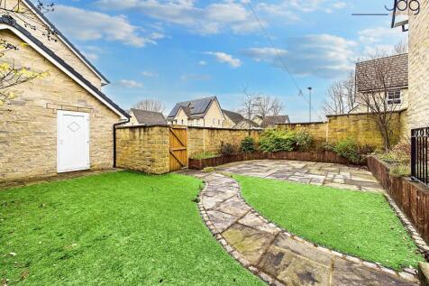 Spacious, Low-Maintenance Garden with Seating Areas and Garage Access