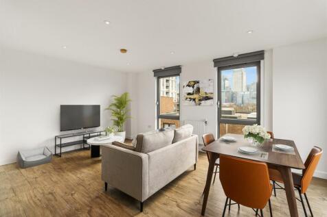 Experience the elegance of contemporary urban living with a stunning cityscape backdrop.