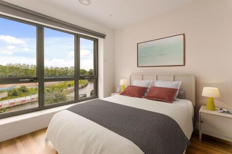 Relax in this inviting bedroom featuring breathtaking views and modern decor.