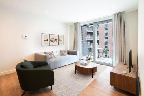 Experience the elegance of urban living with this stylish and inviting living room space.