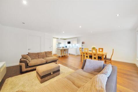 Set across two impressive levels within a boutique development, this outstanding two-bedroom, two-bathroom duplex apartment spans over 1,200 sq ft and combines bright, expansive interiors with rare ou