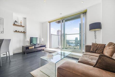 A stylish furnished apartment in the prestigious Pan Peninsula West with a private balcony offering stunning views over Canary Wharf dock, the River Thames and the O2, complemented by world-class amen