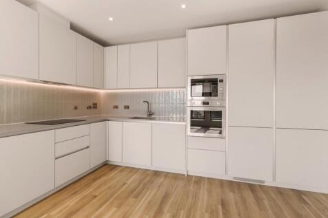 Step into a world of elegance with this sleek modern kitchen, where style meets functionality.
