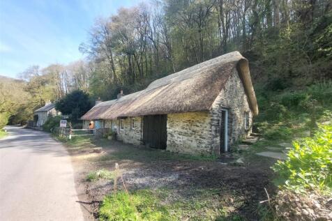thatched workshops and detached house