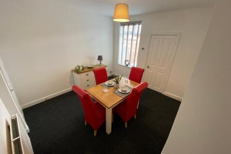 Bright, freshly decorated living/dining room wi...