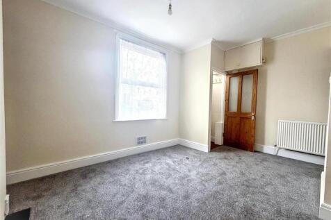 Spacious bedroom with fresh grey carpeting...