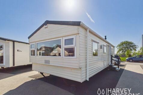 Radiant static caravan exterior at holiday park