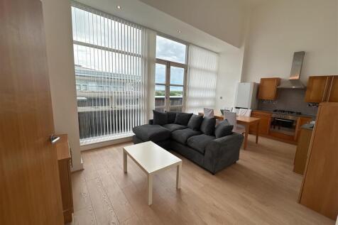 Welcome to this modern apartment located in the vibrant area of Albion Mill, Ancoats. This stylish property boasts two well-proportioned bedrooms and two contemporary bathrooms, making it an ideal cho