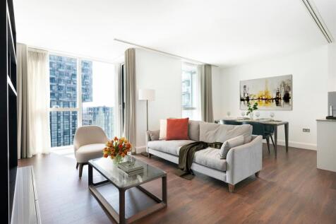 Experience urban elegance in this chic living space with stunning cityscape views.