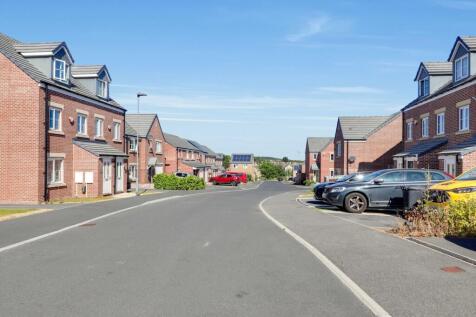 Street view and fields beyond