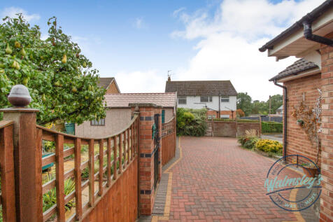Driveway from entrance with garage on left