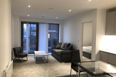 A modern two-bedroom, two-bathroom apartment with a private balcony in the popular Local Crescent development, offering stylish city living close to Manchester with excellent resident facilities.
