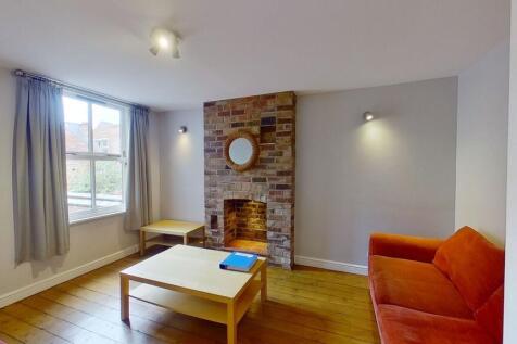 Bright, cosy living room with original wooden f...