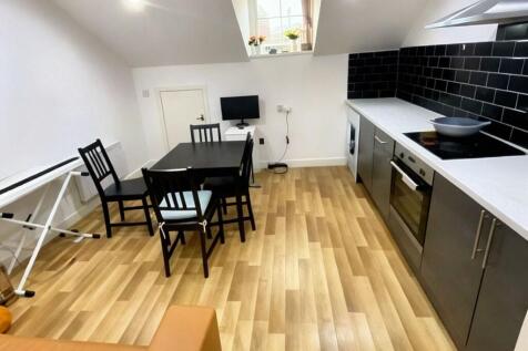 Switch Properties offers this modern higher-floor one-bedroom flat, available from August 2026. The apartment provides bright open-plan living with tall windows and elevated city views. Ideally locate