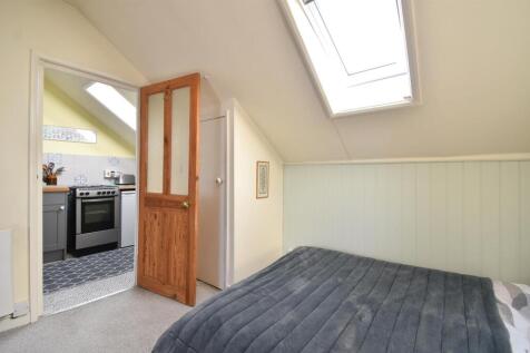 Open plan living space & bedroom